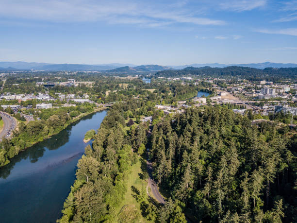 Aerial view of Eugene Oregon and Willamette River Aerial view of Eugene Oregon with the Willamette River snaking its way through downtown Eugene. Iconic buildings including University Satdium and Knight Center in view. eugene oregon stock pictures, royalty-free photos & images