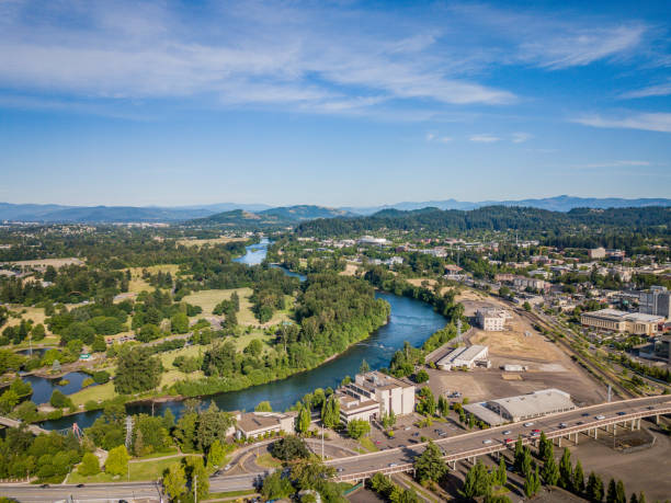 Aerial view of Eugene Oregon and Willamette River Aerial view of Eugene Oregon with the Willamette River snaking its way through downtown Eugene. Iconic buildings including University Satdium and Knight Center in view. eugene oregon stock pictures, royalty-free photos & images