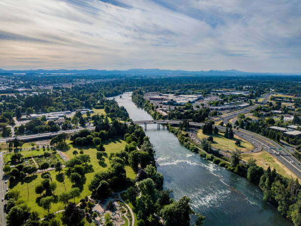 Aerial view of Eugene Oregon and Willamette River Aerial view of Eugene Oregon with the Willamette River snaking its way through downtown Eugene. Iconic buildings including University Satdium and Knight Center in view. eugene oregon stock pictures, royalty-free photos & images