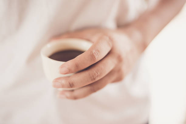 istock Blurred woman drinks coffee in morning. 978513808