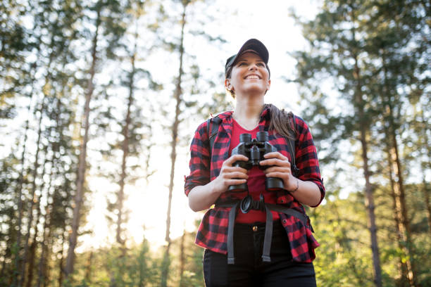 istock Young girl on hiking with binoculars 978519424