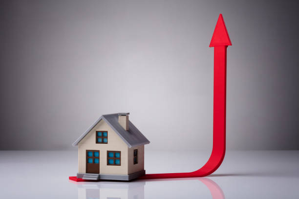istock Close-up Of House Model On Red Arrow 978520150