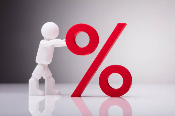 istock Figurine Pushing Red Percentage Sign 978520640