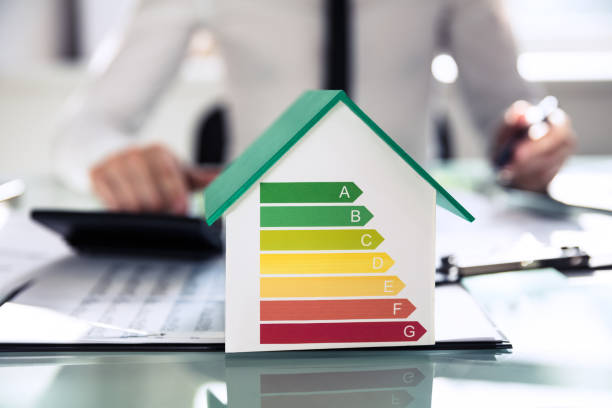 istock Close-up Of House Model Showing Energy Efficiency Rate 978522988