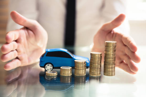 istock Person Protecting Increasing Stacked Coins And Car 978523104