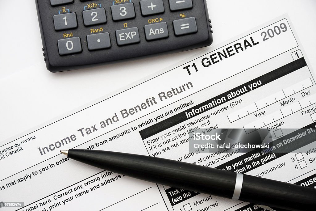 Filling in canadian tax form  Tax Form Stock Photo