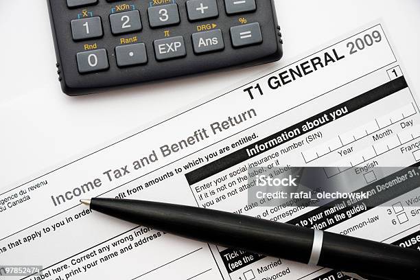 Filling In Canadian Tax Form Stock Photo - Download Image Now - Tax Form, Canada, 2009