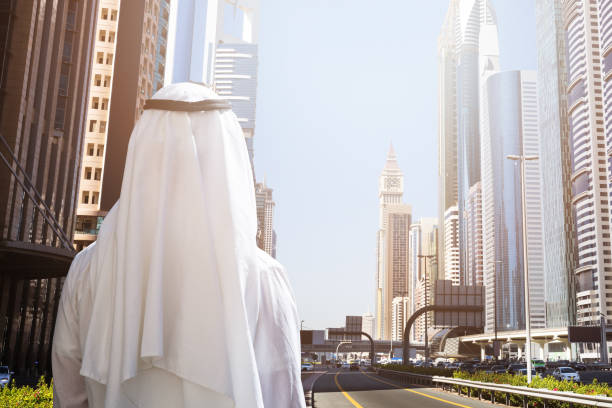 istock Man Standing In Front Of Dubai Cityscape 978525566