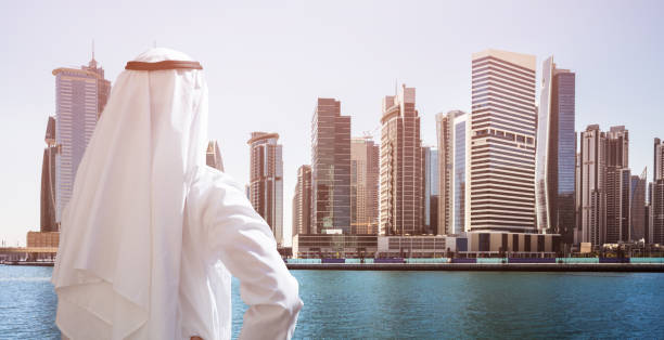 istock Man Standing In Front Of Dubai Business Bay 978525574