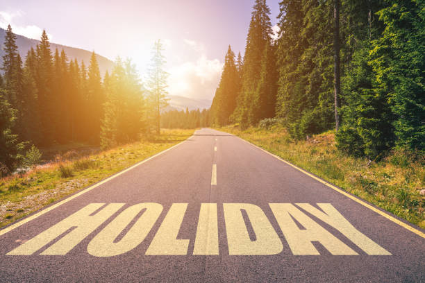 istock Holiday word written on road in the mountains 978525846