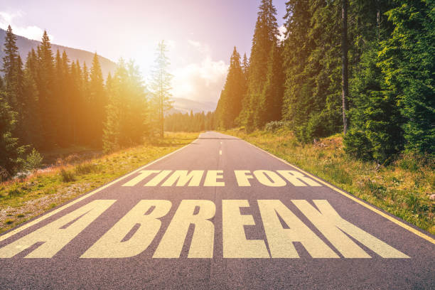 istock Time for a break text written on road in the mountains 978525848