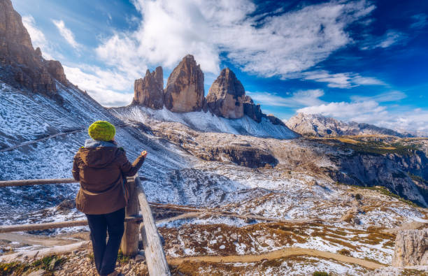 istock Explorer searching direction with compass in summer mountains, point of view. 978525978