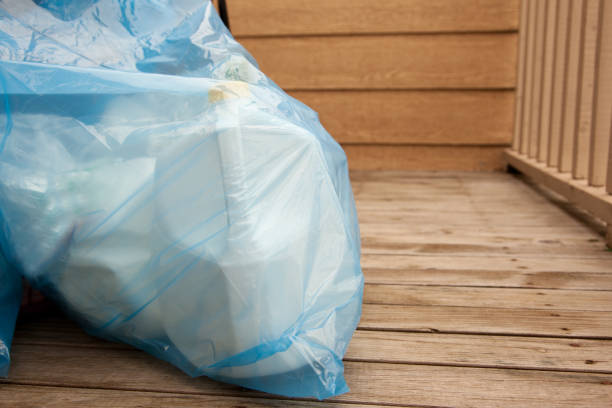 istock Blue recycling bag on the porch 978526236