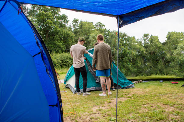 istock family preparing the tent in camping trip 978535248