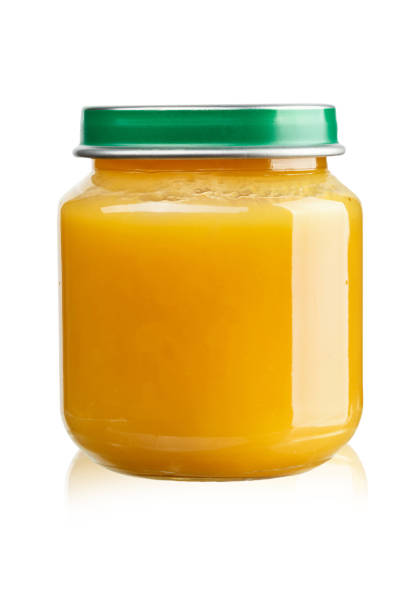 istock fruit puree for children in a jar on a white background, isolated. 978545718