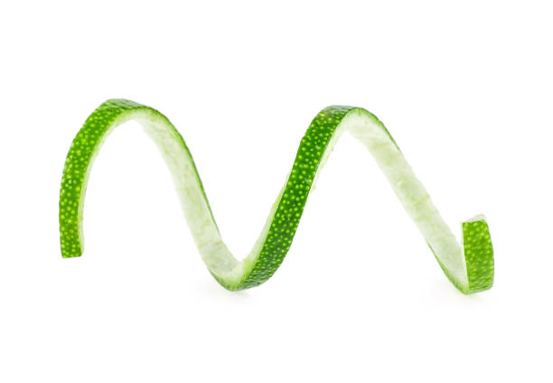 Peel of fresh ripe lime on white background