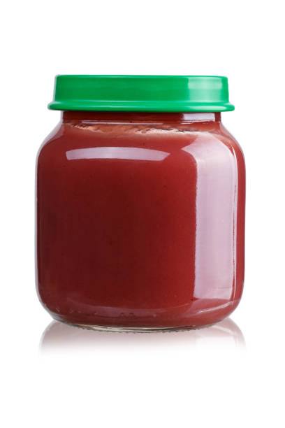 istock fruit puree for children in a jar on a white background, isolated. 978555406
