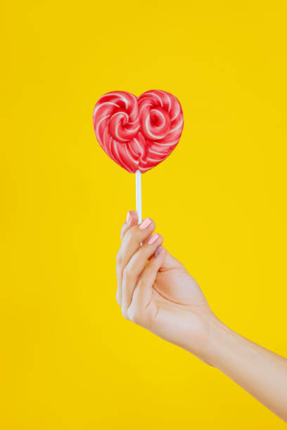 istock Lollipop in woman hand. 978561812