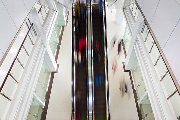istock Motion blurred people on stairs and escalator 97856867