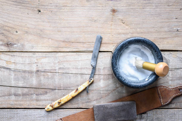 istock Old vintage barbershop tools on wooden table 978577848