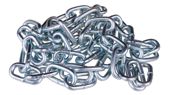 Jumbled pile of shiny silvery links connected in the solid steel chain. Loop, linkageIdea of strength, firmness, fixing, proofness and security