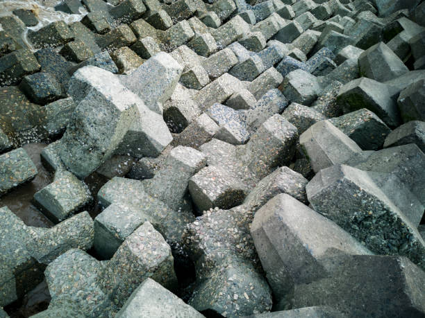Closeup concrete tetrapod at coast line prevent erosion and protection.