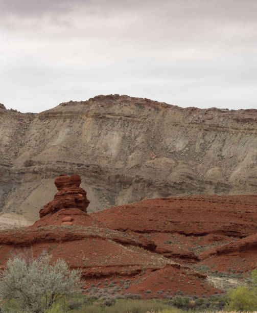 istock A Knobby Red Rock Formation with Clouds Above 978604260