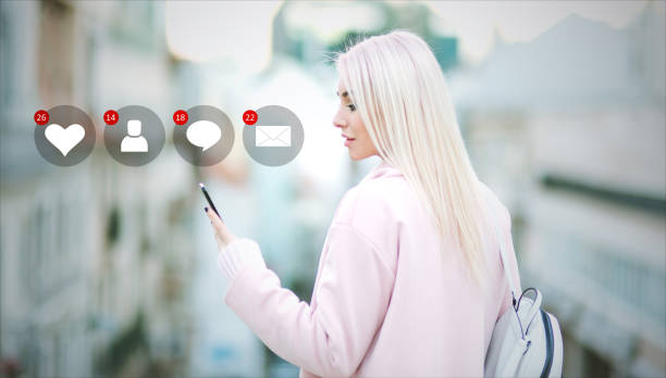 istock Beautiful young woman in real life using smartphone 978611874