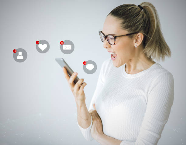 istock Beautiful young woman in real life using smartphone 978611896