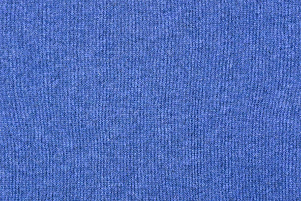 istock Fabric knitting wool texture blue color. Cloth knitted wool surface. 978615606