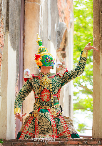 Thotsakan (ten faces giant) in Khon or Traditional Thai Pantomime as a cultural dancing arts performance in masks dressed based on the characters in Ramakien or Ramayana Literature.