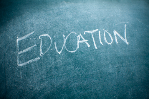 Hand written on the chalkboard. Education takes focus.