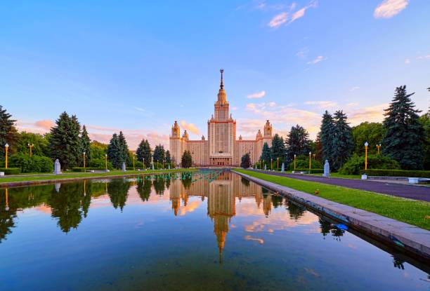 istock Wide angle vibrant panoramic view of sunset Moscow university campus under dramatic sky in spring with water reflections and red ducks 978657814