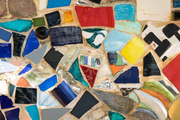istock Wall made of colored stones and multicolored ceramic pieces. 978658136