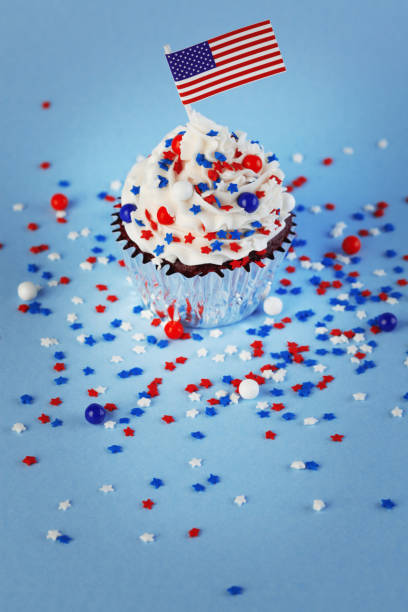 istock 4th of July cupcake with flag and sprinkles 978658260