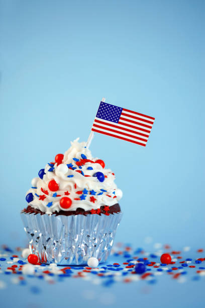 istock 4th of July cupcake with flag and sprinkles 978658454