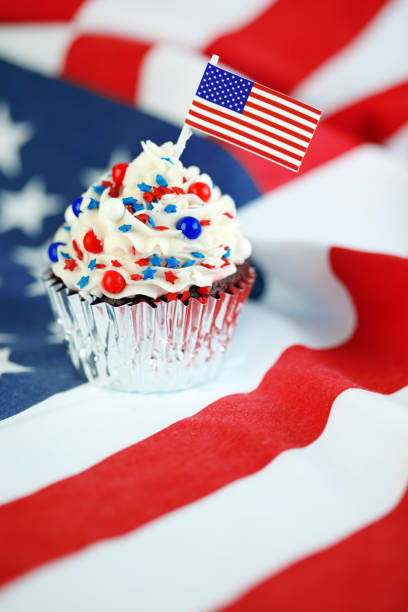 istock 4th of July cupcake with flag and sprinkles 978658626