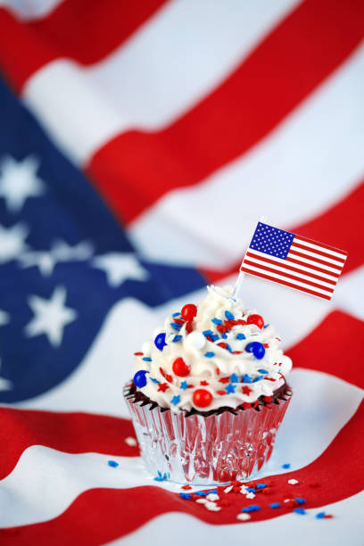 istock 4th of July cupcake with flag and sprinkles 978658674