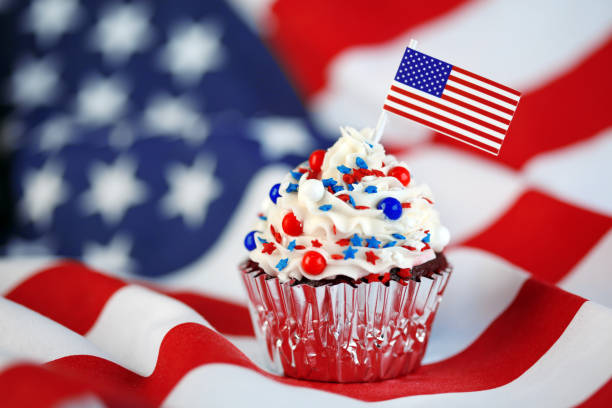 istock 4th of July cupcake with flag and sprinkles 978658736