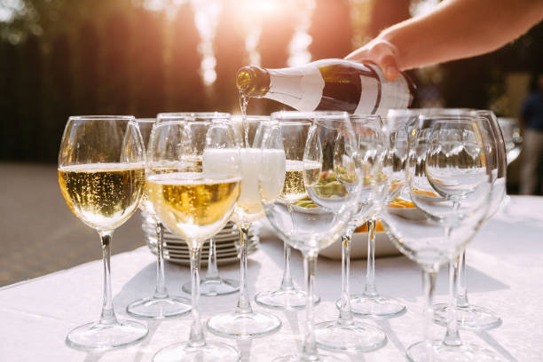 istock Bartender pouring champagne into glass 978674788