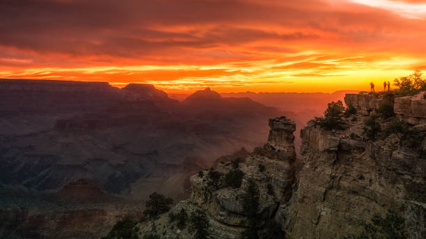 Grand Canyon Sunrise at Yaki Point Rising sun - silhouette of photographers taking pictures yaki point stock pictures, royalty-free photos & images