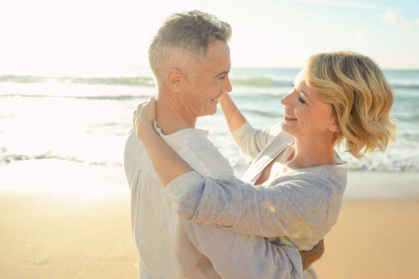 istock Mature couple dancing on the beach. 978711674