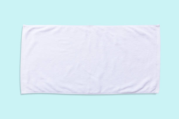 istock White beach towel mock up isolated with clipping path on blue background, flat lay top view 978724386
