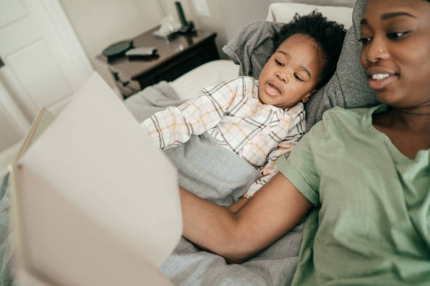 istock Reading to a child at bedtime. 978724412