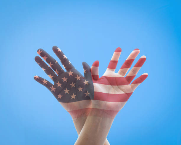 istock America flag pattern on people's hands in American eagle bird shape for USA holiday celebration concept 978724880