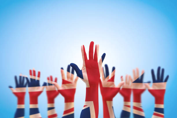 istock United kingdom (UK) flag pattern on person human people hands. 978725582