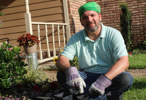 istock Male gardener in front yard 978736898