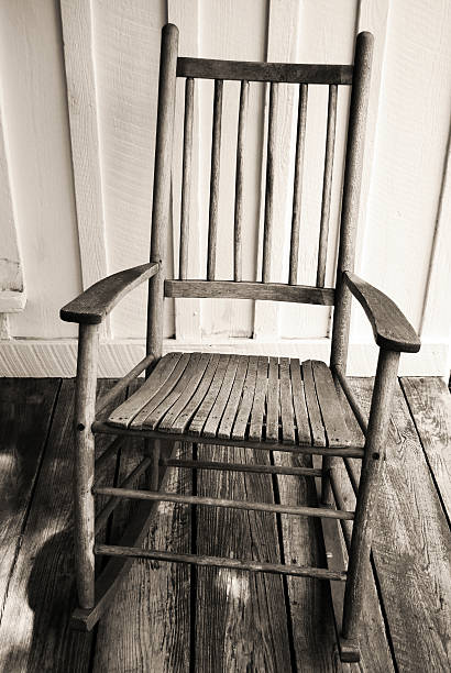 istock Rustic Wooden Rocking Chair on Old Front Porch 97874218