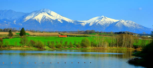 Landscape of Hokkaido, Biei, Mizusawa dam lake, Tokachi dake mountains stock photo