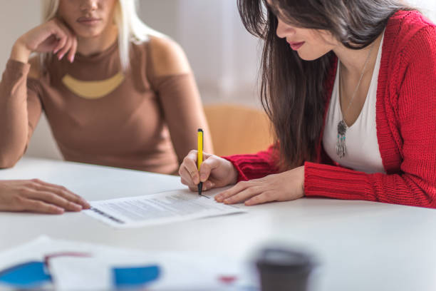 istock Girl signing contract 978754808